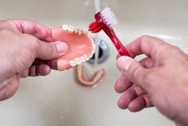 https://www.drelloway.com/wp-content/uploads/denture-care-type-of-toothbrush.jpg
